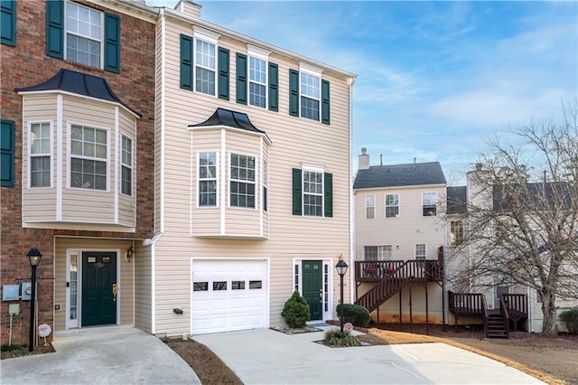 townhome / multi-family property featuring a garage