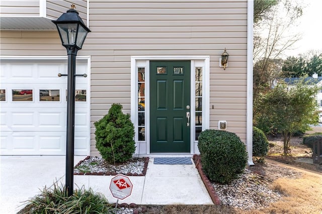 entrance to property featuring a garage