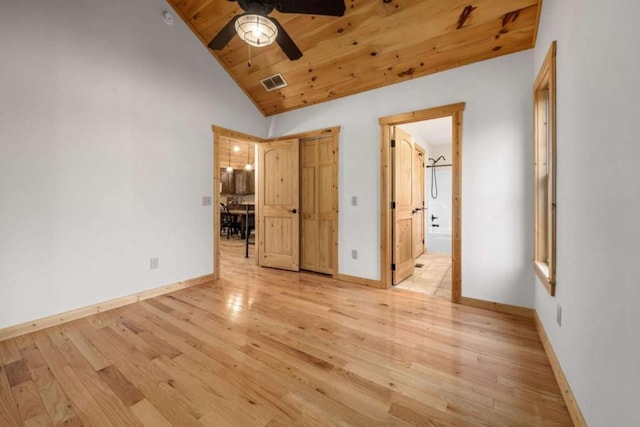 unfurnished bedroom featuring wood ceiling, baseboards, vaulted ceiling, visible vents, and light wood-style floors