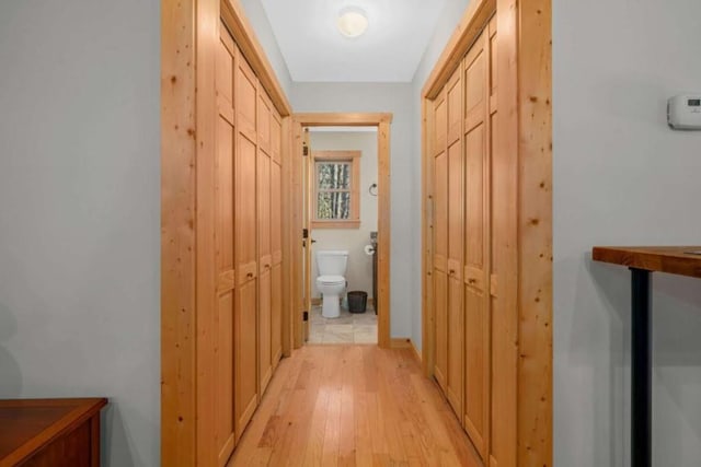 corridor featuring light wood-style flooring