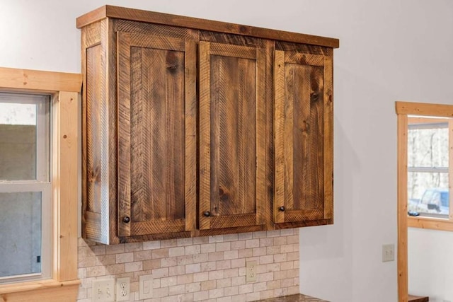 details with tasteful backsplash and brown cabinetry