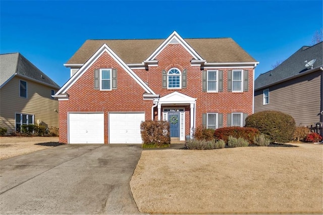 view of front of property with a garage