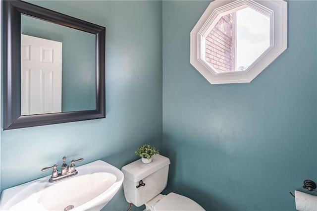 bathroom with sink and toilet