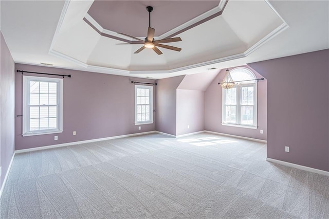 additional living space with ceiling fan with notable chandelier and light colored carpet