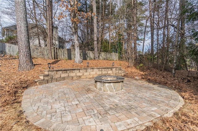 view of patio / terrace featuring a fire pit