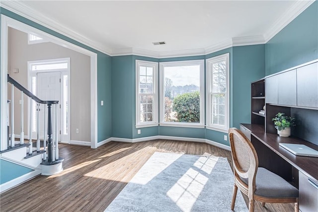 office space featuring wood-type flooring and ornamental molding