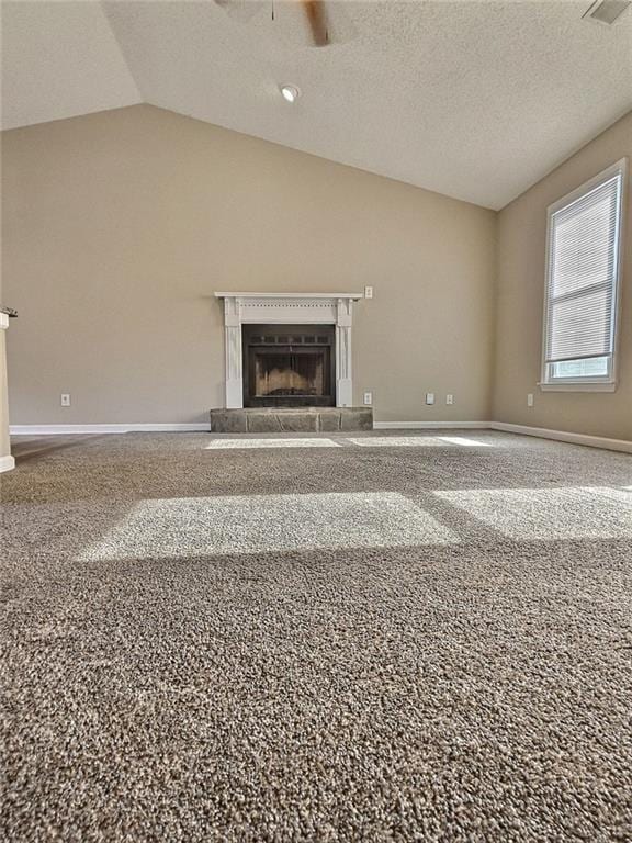 unfurnished living room featuring a fireplace, baseboards, a ceiling fan, and vaulted ceiling