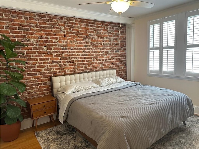 1078 Piedmont Ave NE Unit 206, Atlanta, GA 30309 - bedroom with brick wall, ornamental molding, multiple windows, wood finished floors, and ceiling fan