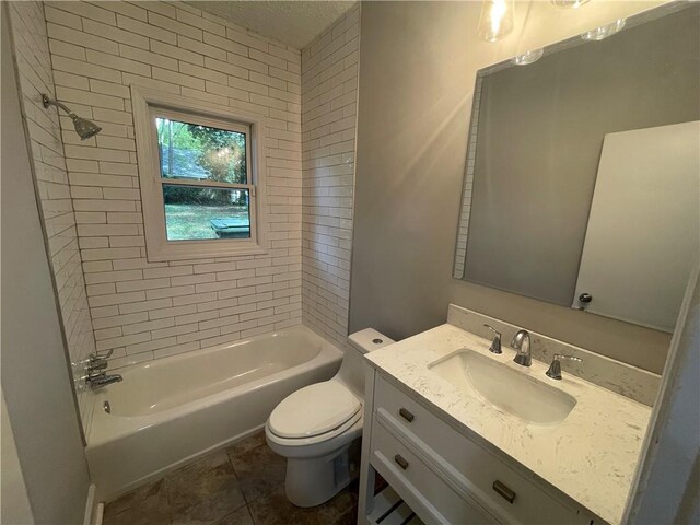 full bathroom with vanity, toilet, tiled shower / bath combo, and tile patterned floors