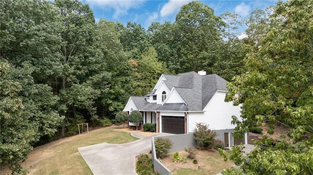 view of front of house with a garage and a front yard