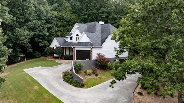 view of front of property with a garage and a front yard