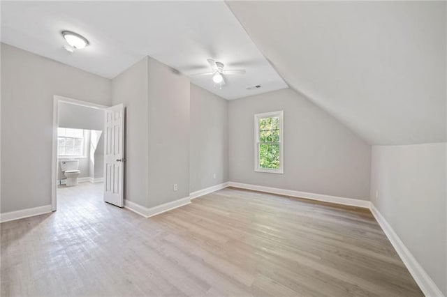 bonus room with vaulted ceiling, ceiling fan, and light hardwood / wood-style floors