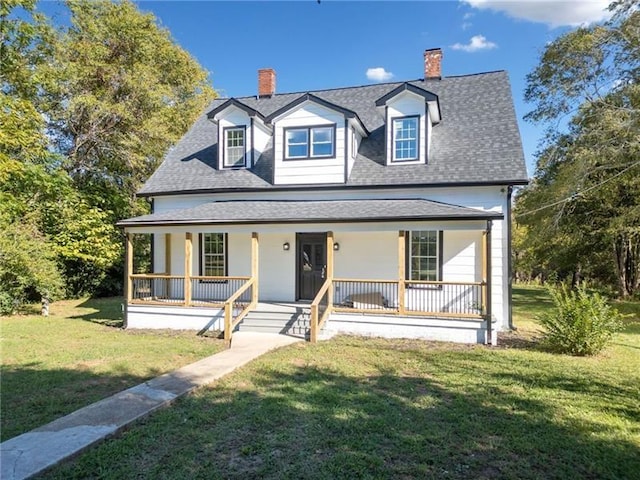 view of front facade with covered porch and a front lawn