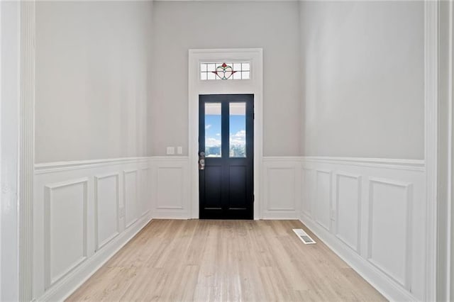 doorway to outside with light hardwood / wood-style floors