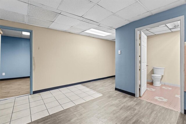 843 Mcafee St, Dalton, GA 30721 - finished basement with wood finished floors and a drop ceiling