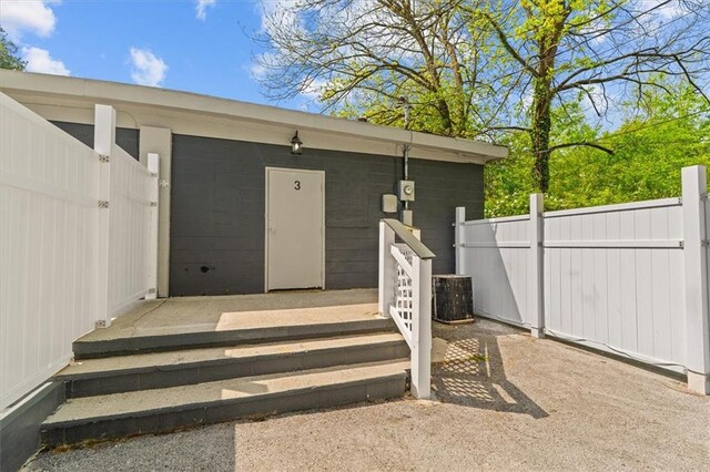 843 Mcafee St, Dalton, GA 30721 - property entrance with fence and concrete block siding