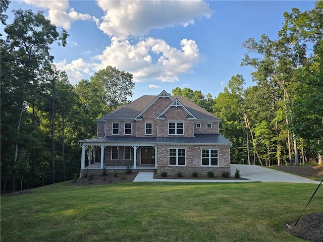 view of front of house featuring a porch and a front lawn