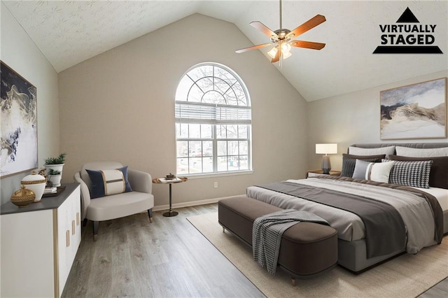 11143 Aliyah Dr, Hampton, GA 30228 - bedroom featuring vaulted ceiling, baseboards, light wood finished floors, and ceiling fan