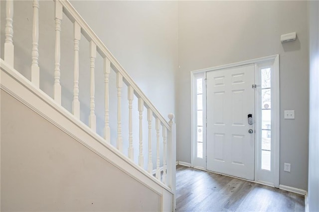 11143 Aliyah Dr, Hampton, GA 30228 - foyer entrance with stairs, wood finished floors, baseboards, and a wealth of natural light