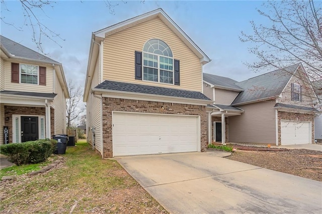 11143 Aliyah Dr, Hampton, GA 30228 - view of front of house with brick siding, concrete driveway, an attached garage, and a shingled roof