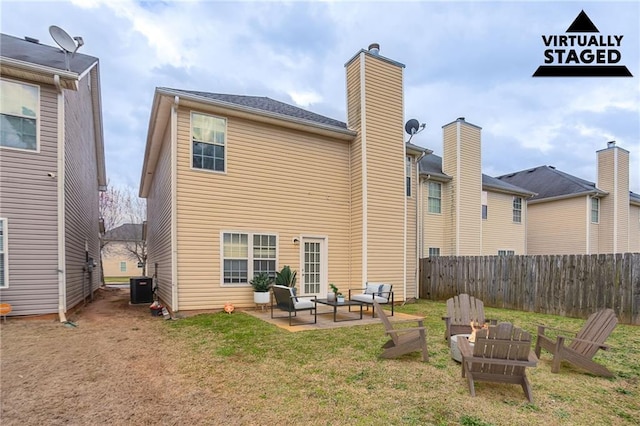 11143 Aliyah Dr, Hampton, GA 30228 - rear view of house featuring central air condition unit, a patio, a lawn, and fence