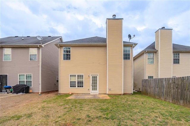 11143 Aliyah Dr, Hampton, GA 30228 - back of house featuring a patio area, a chimney, a yard, and fence