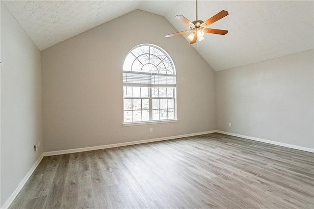 11143 Aliyah Dr, Hampton, GA 30228 - unfurnished room with vaulted ceiling, wood finished floors, baseboards, and ceiling fan