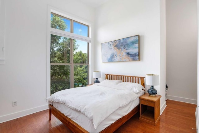 1195 Milton Ter SE Unit 1407, Atlanta, GA 30315 - bedroom with baseboards and wood finished floors