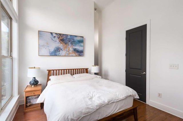 1195 Milton Ter SE Unit 1407, Atlanta, GA 30315 - bedroom featuring dark wood-type flooring and baseboards