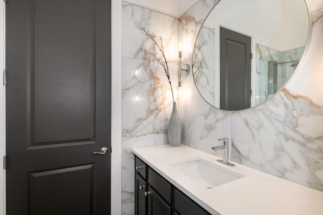 1195 Milton Ter SE Unit 1407, Atlanta, GA 30315 - full bathroom featuring vanity, decorative backsplash, a marble finish shower, and tile walls