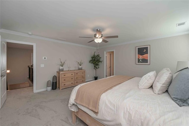 carpeted bedroom with ornamental molding and ceiling fan