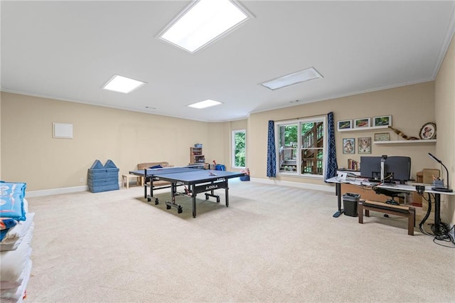 game room with carpet, baseboards, ornamental molding, and a desk