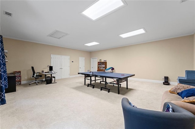 playroom featuring a desk, light colored carpet, attic access, baseboards, and crown molding