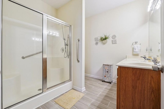 119 Holiday Rd, Unit Buford, GA 30518 - full bathroom featuring a stall shower, double vanity, and wood finish floors