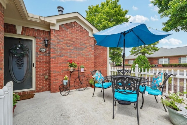119 Holiday Rd, Unit Buford, GA 30518 - view of patio / terrace with outdoor dining area