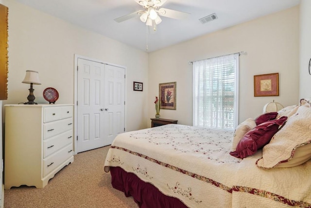 119 Holiday Rd, Unit Buford, GA 30518 - bedroom featuring light colored carpet, a closet, and a ceiling fan
