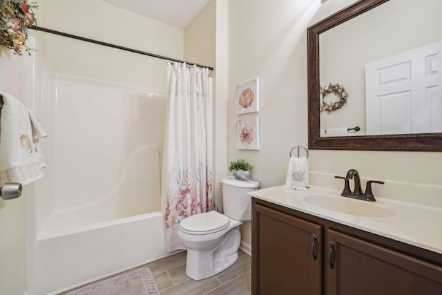 119 Holiday Rd, Unit Buford, GA 30518 - full bathroom with vanity, shower / bath combo with shower curtain, and wood tiled floors