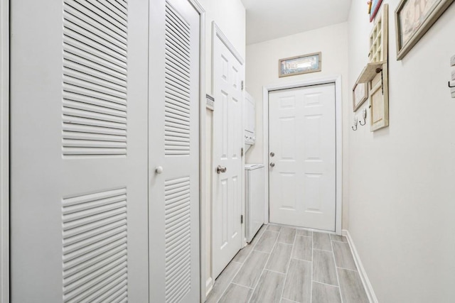 119 Holiday Rd, Unit Buford, GA 30518 - hallway featuring baseboards and wood tiled floors
