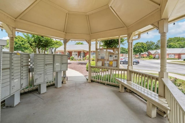 119 Holiday Rd, Unit Buford, GA 30518 - view of patio / terrace with mail area and a residential view