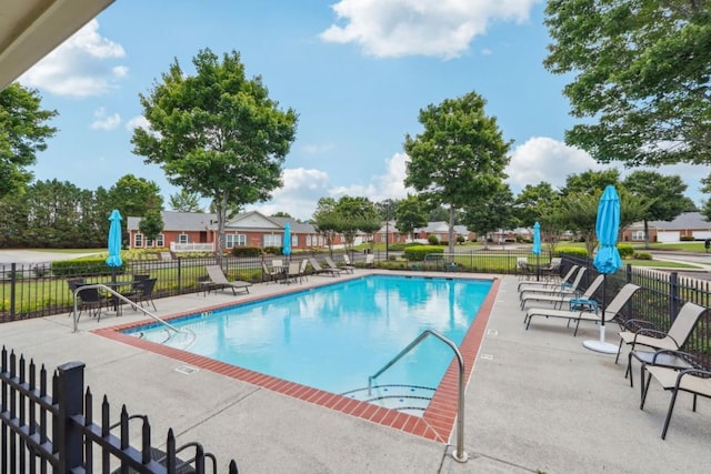 119 Holiday Rd, Unit Buford, GA 30518 - community pool featuring a patio