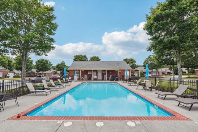 119 Holiday Rd, Unit Buford, GA 30518 - community pool featuring a patio area