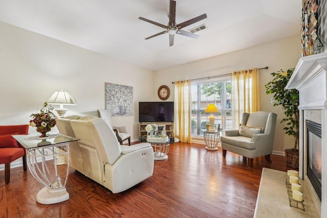 119 Holiday Rd, Unit Buford, GA 30518 - living room featuring a glass covered fireplace, wood finished floors, and ceiling fan