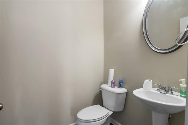 bathroom featuring sink and toilet