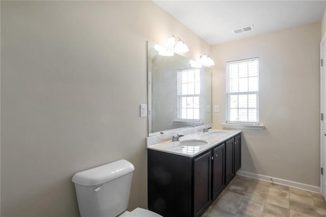 bathroom with vanity and toilet