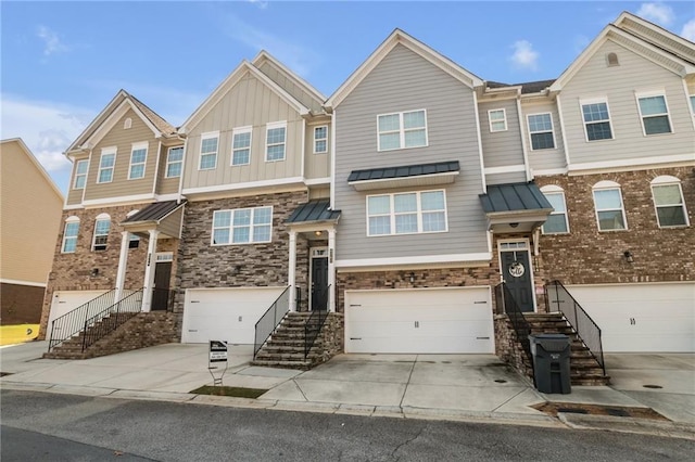 4262 Buford Valley Way, Buford, GA 30518 - multi unit property featuring a garage, concrete driveway, stone siding, and a standing seam roof