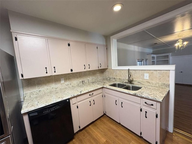 2807 Mcclave Dr, Doraville, GA 30340 - kitchen featuring a sink, black dishwasher, freestanding refrigerator, light wood-style floors, and recessed lighting