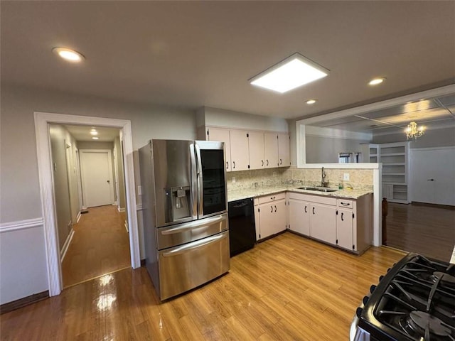 2807 Mcclave Dr, Doraville, GA 30340 - kitchen featuring stainless steel fridge with ice dispenser, dishwasher, a sink, light wood-style floors, and recessed lighting
