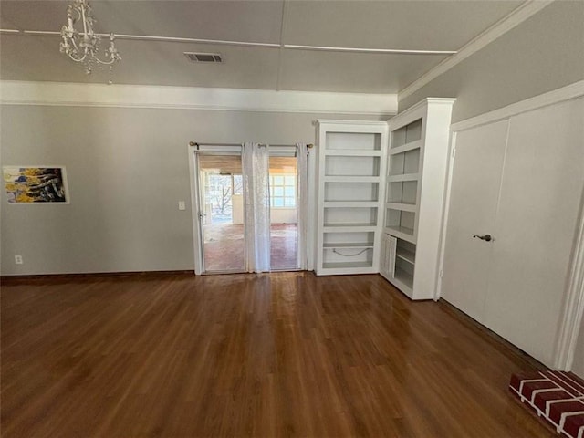 2807 Mcclave Dr, Doraville, GA 30340 - unfurnished room featuring wood finished floors, a chandelier, and ornamental molding