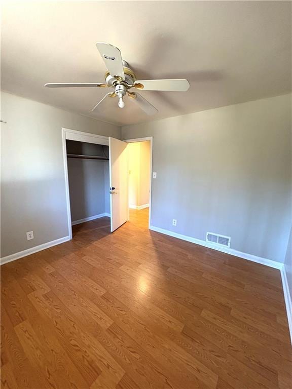 2807 Mcclave Dr, Doraville, GA 30340 - unfurnished bedroom with baseboards, wood finished floors, and a closet