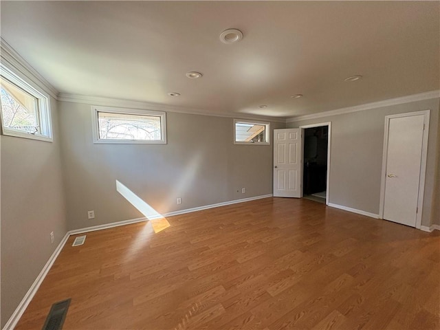 2807 Mcclave Dr, Doraville, GA 30340 - spare room with ornamental molding, wood finished floors, and baseboards